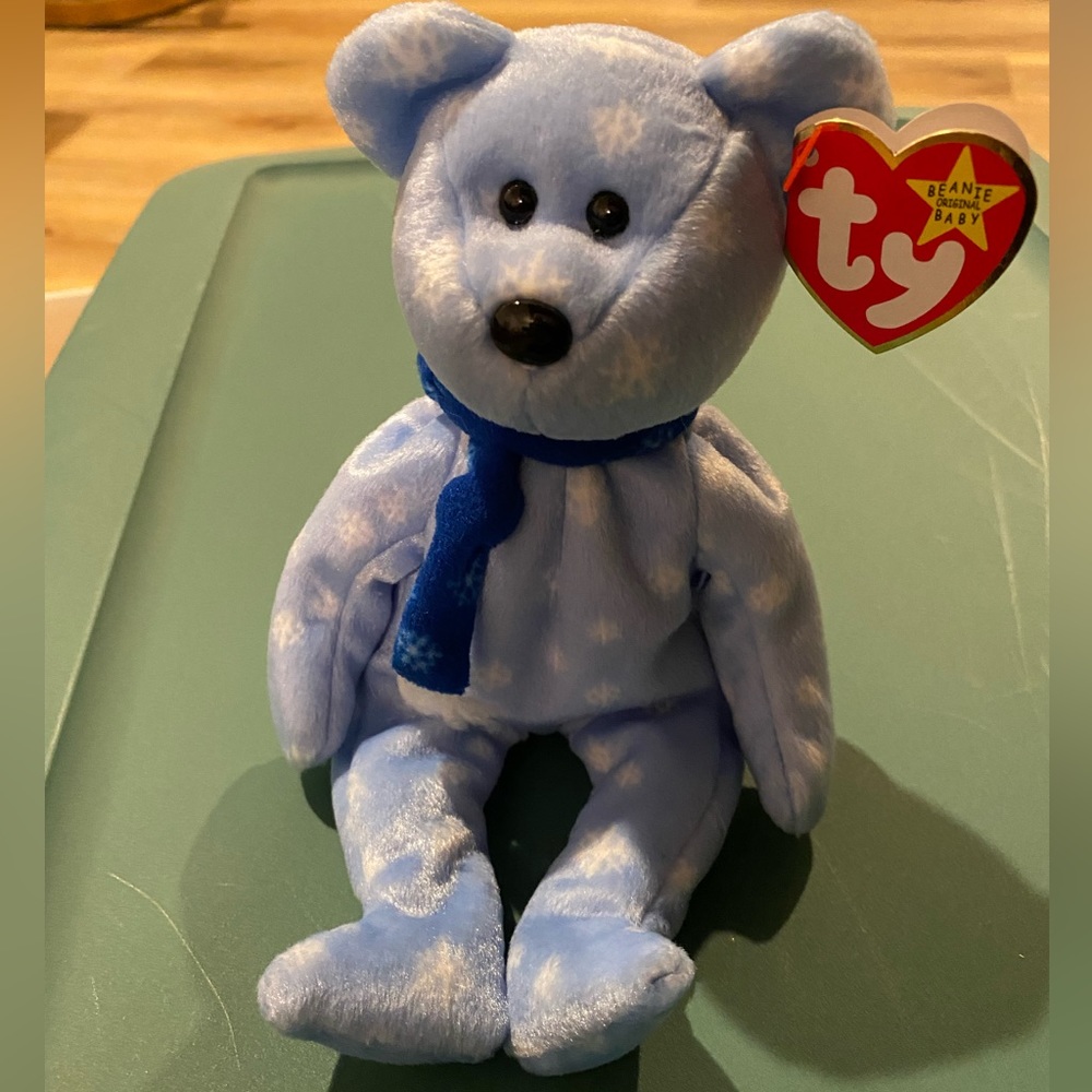 NWT BEANIE BABY - “1999 Holiday Teddy” bear, kept in collectible case.